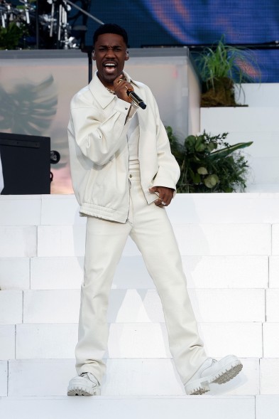 Giveon wears a white leather suit during his performance at Governors Ball 2023.
