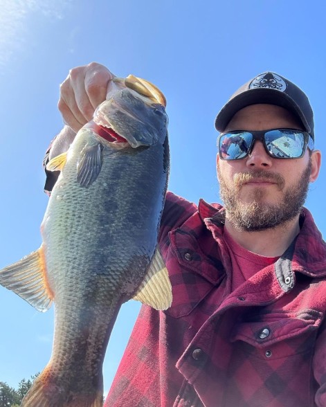 Chris Pratt holding up a fish