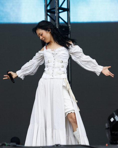 Rina Sawayama wears a white corset gown during her performance at Governors Ball 2023.